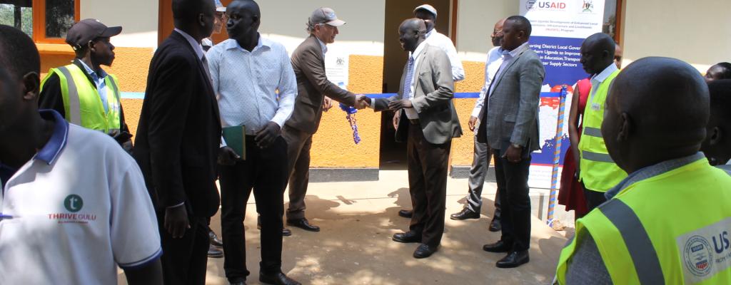 Commissioning of Rehabilitation of School Facilities at Ogako Lacan Primary School by USAID Mission Director - Mr. Richard L. Nelson and Deputy Resident District Commissioner - Mr. Oguti Sebastian Oswin.
